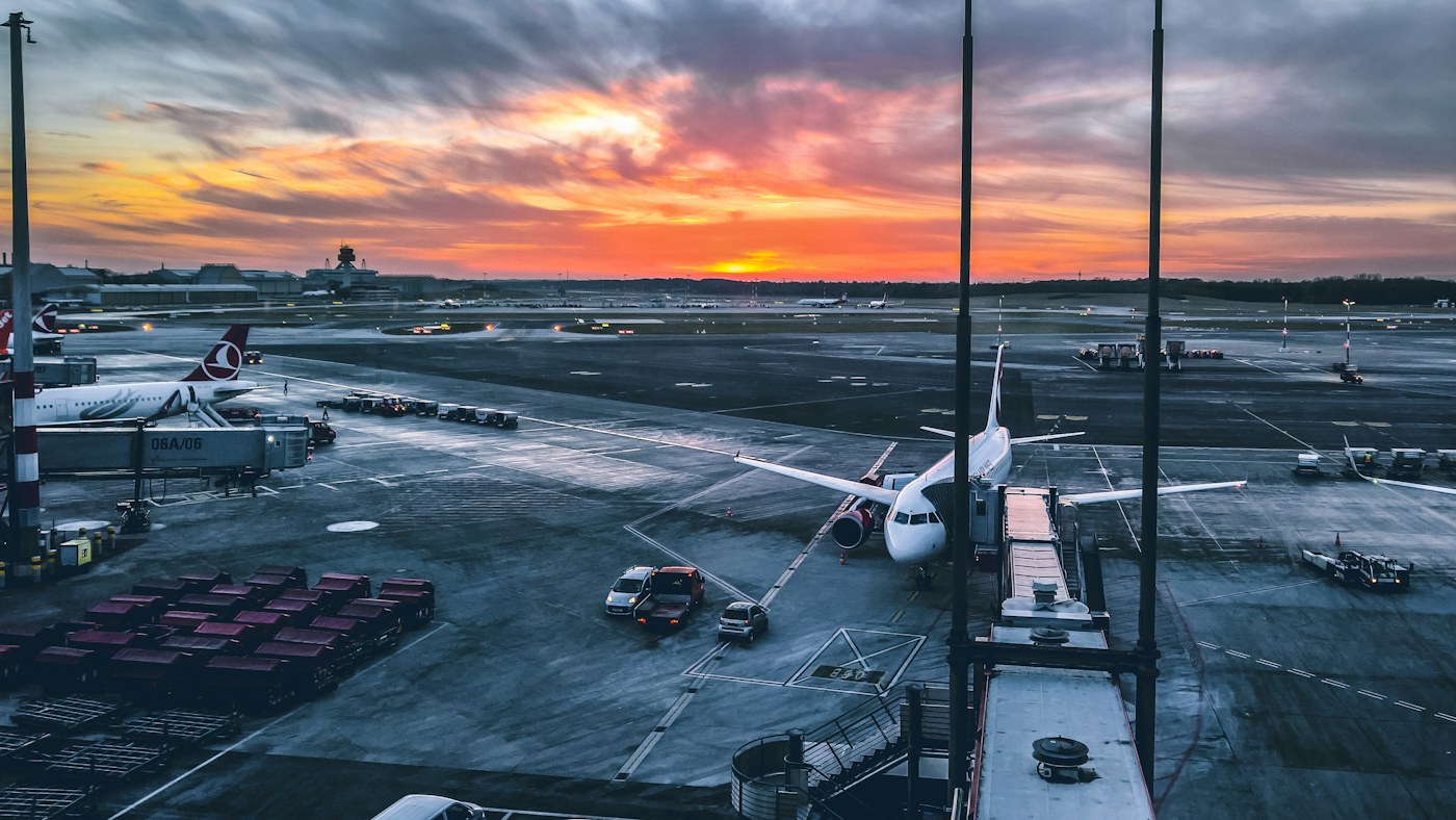 Aircraft at an airport at sunset